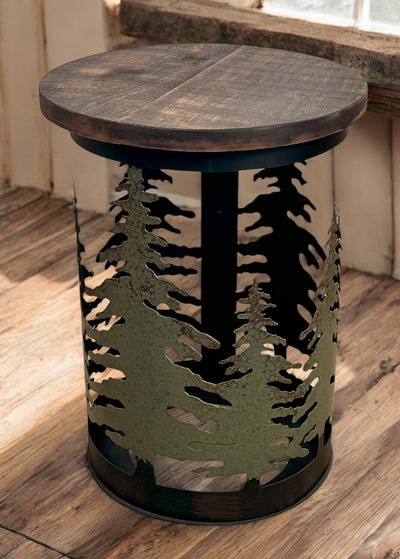 Rugged metal pine tree end table with rough sawn wood top displayed on a wood floor.
