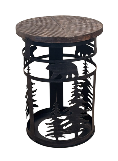Iron cylinder metal end table with pine tree and bear accent with a rough wood sawn top on a white background.