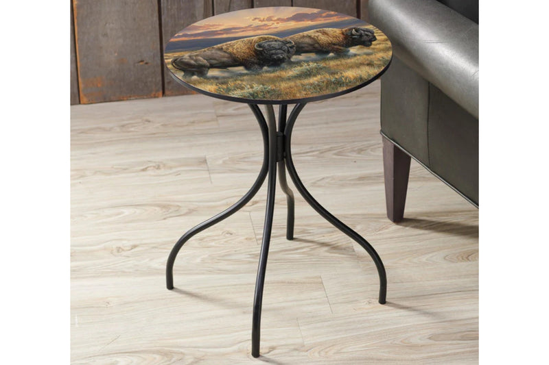 Metal round side table featuring a buffalo design by Rosemary Millette on a wooden floor