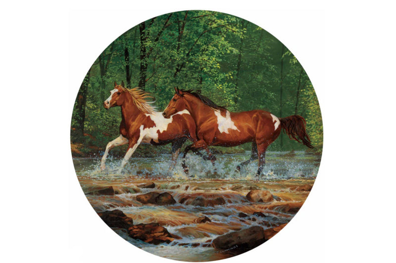 Metal table top round artwork of two horses running through a mountain creek titled "Spring Creek Run Horses II" by Chris Cummings.