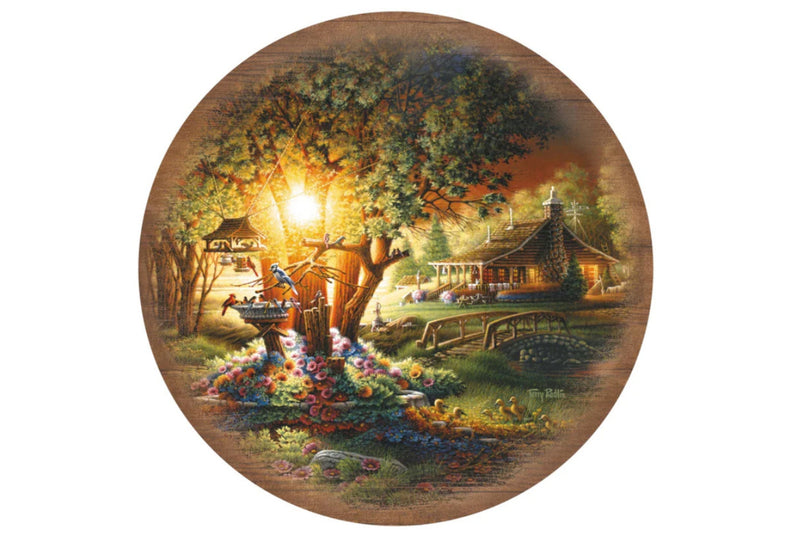 Round metal table top featuring artwork by Terry Redlin titled "Colors of Spring".