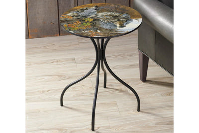 Round metal side table featuring a wolf design top on a wood floor.